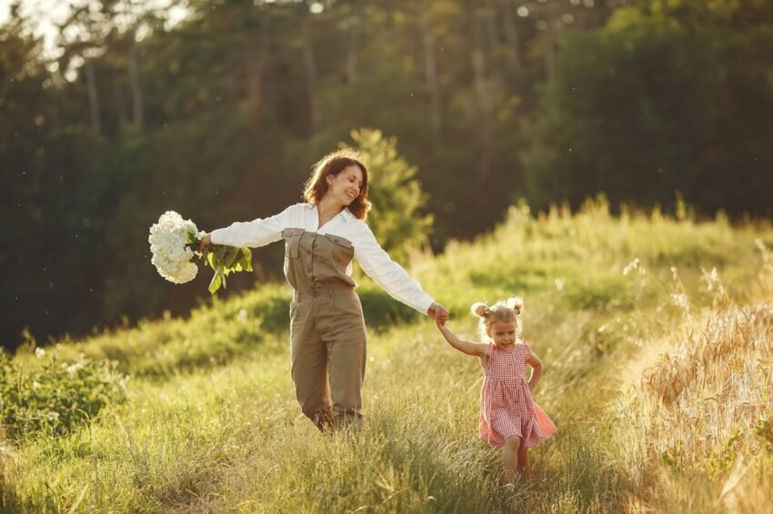 Parent and child embracing Slow Parenting by enjoying an outdoor moment together.