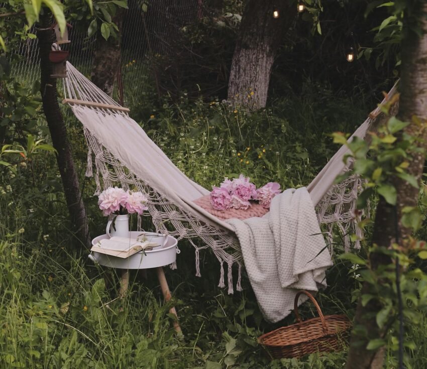 A person embracing slow living by enjoying a quiet moment surrounded by nature